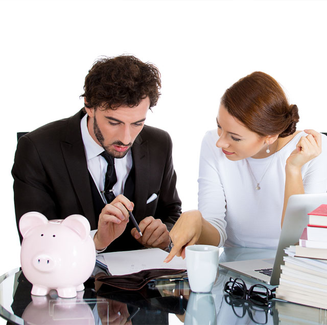 Image showing two people in a business meeting looking at some documents together